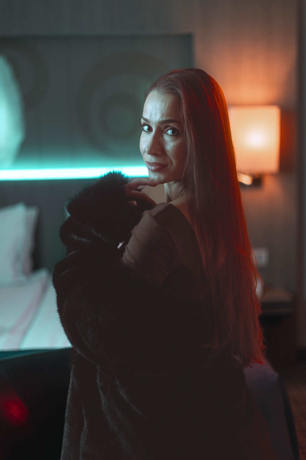 Fashion film still, contemplative pose, neon ambience