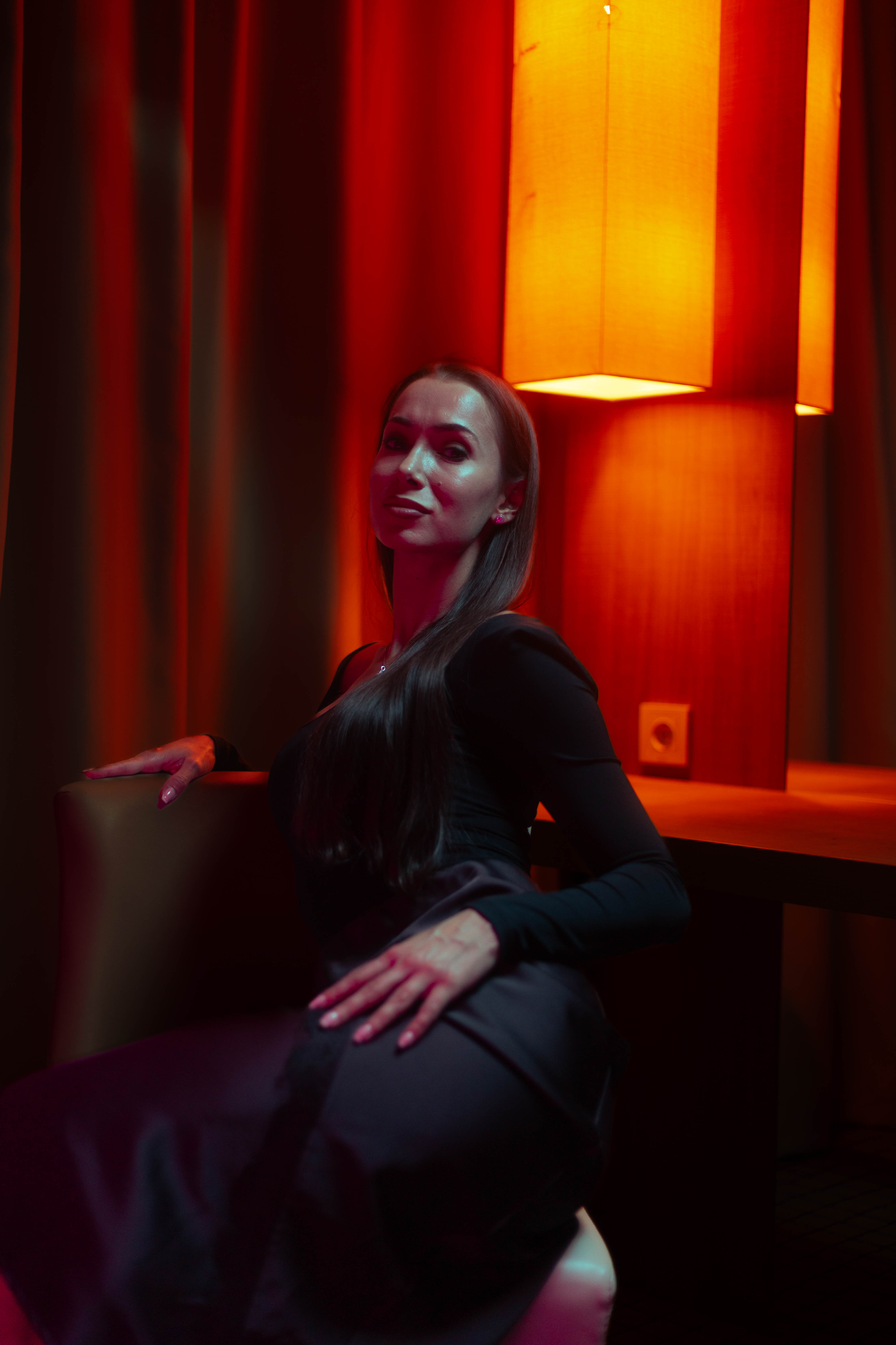 Luxury portrait, three-quarter seated, satin gown, ember backdrop