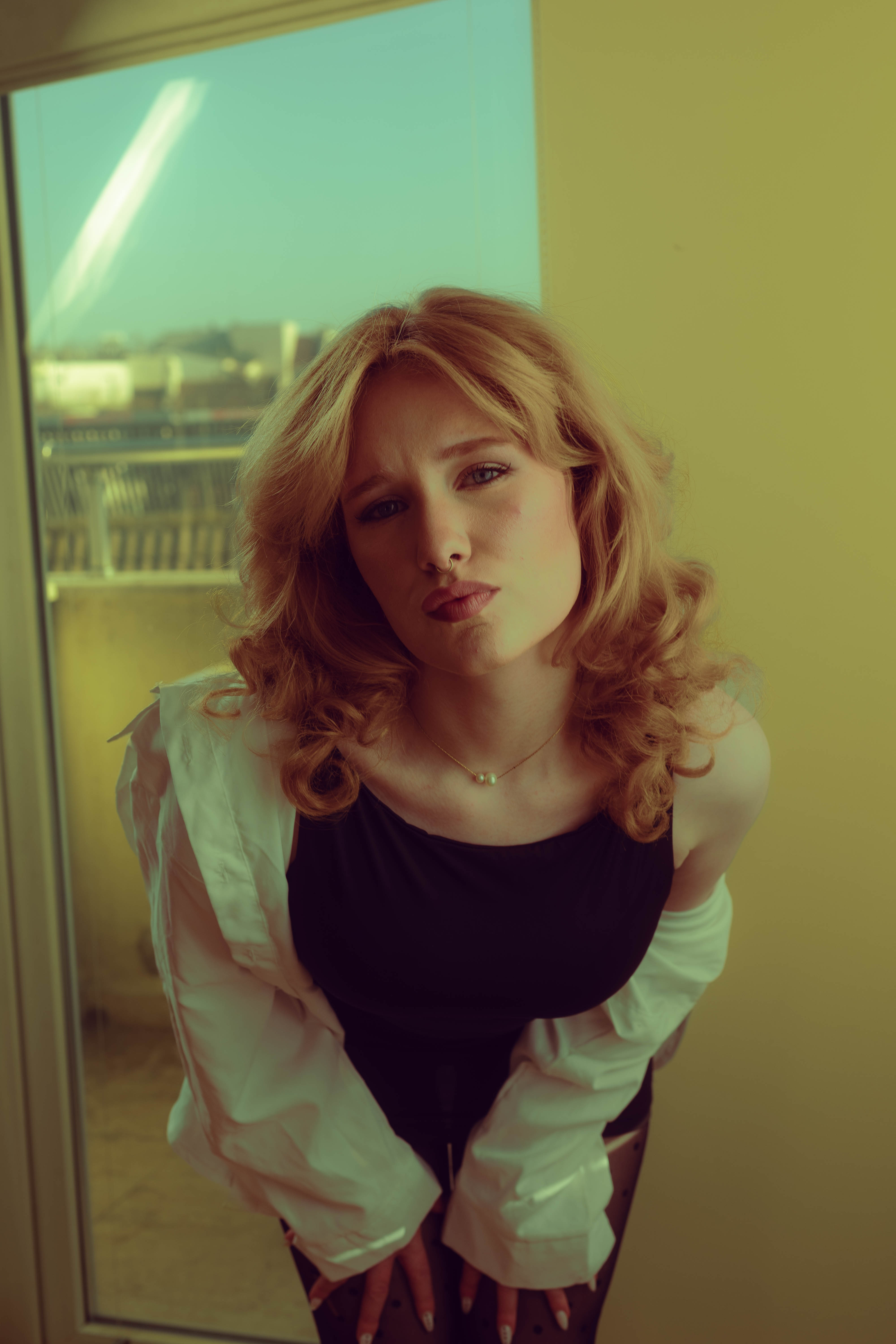 Atelier story, white shirt over shoulder, vintage window light