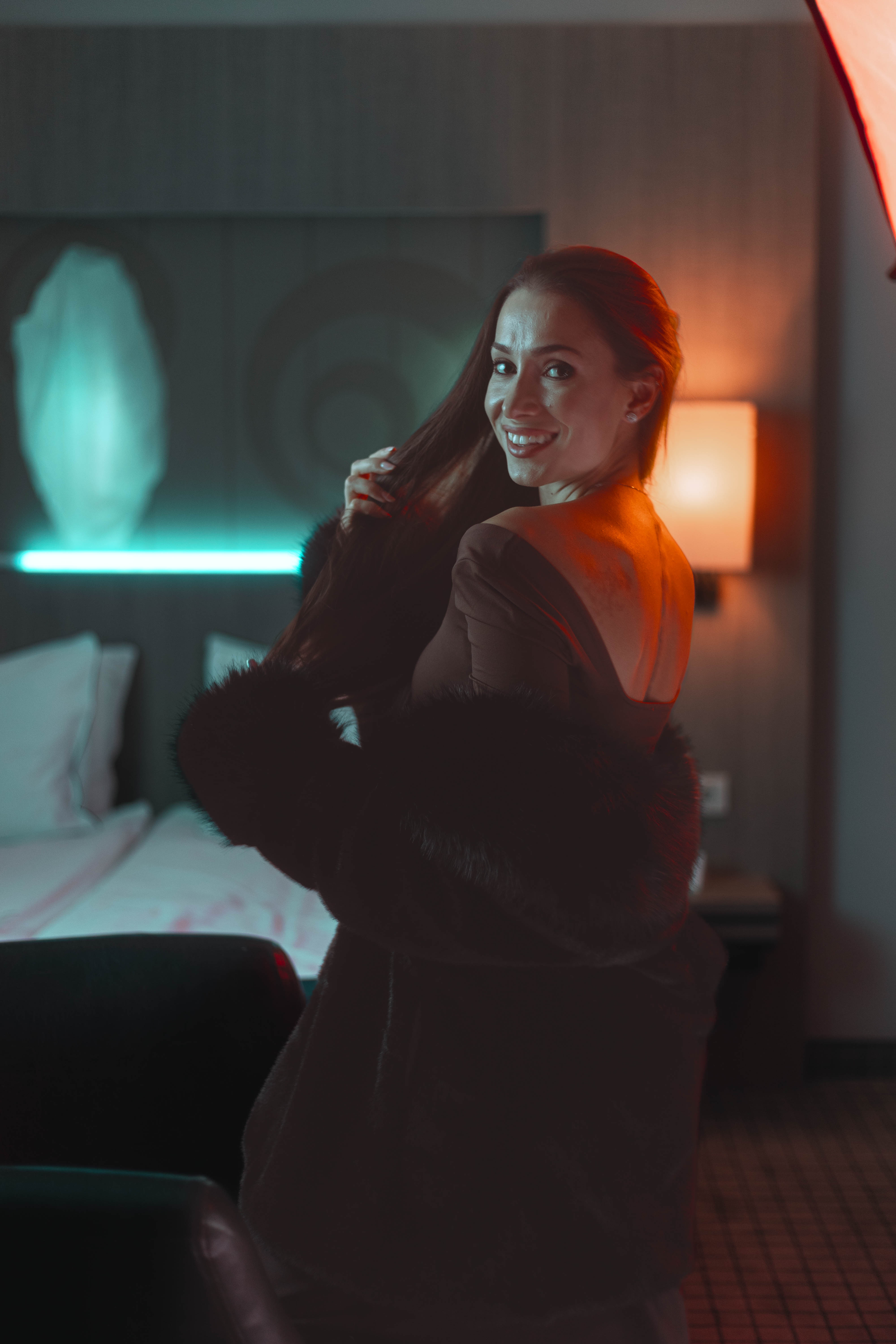 Brand campaign frame, wide interior context, ember and teal palette