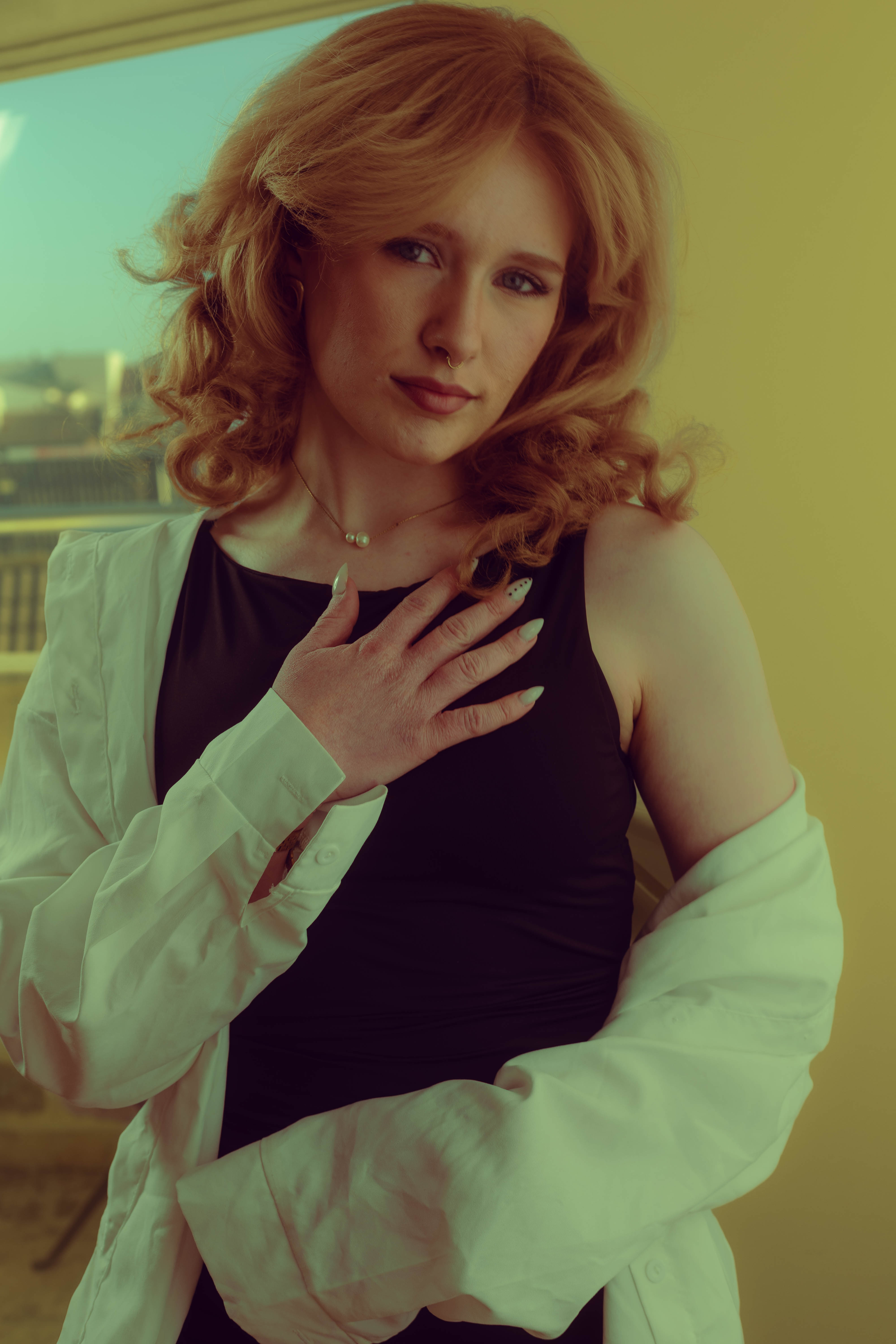 Luxury portrait, white shirt over black slip, soft window light